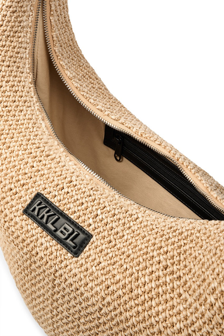 Moon Bag Crochet, Detailfreisteller Crochet-Baststruktur mit aufgesetztem schwarzen KKLBL-Label